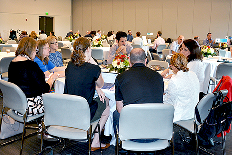 people around a table talking